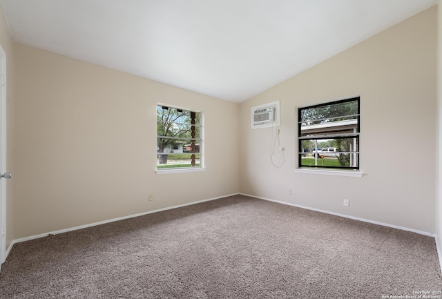 4863 Castle Shield, San Antonio, TX 78218 - empty room featuring an AC wall unit, plenty of natural light, carpet floors, vaulted ceiling, and baseboards