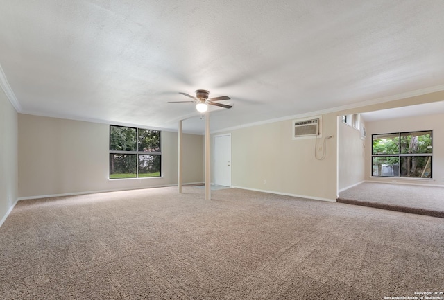 4863 Castle Shield, San Antonio, TX 78218 - unfurnished room featuring crown molding, healthy amount of natural light, ceiling fan, a wall mounted AC, and carpet