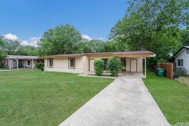 4863 Castle Shield, San Antonio, TX 78218 - ranch-style house with concrete driveway, a carport, and brick siding