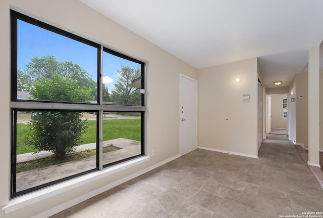 4863 Castle Shield, San Antonio, TX 78218 - spare room featuring baseboards and light stone finish floors