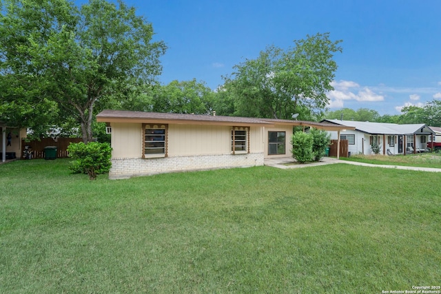 4863 Castle Shield, San Antonio, TX 78218 - ranch-style home featuring a front lawn and brick siding