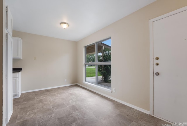 4863 Castle Shield, San Antonio, TX 78218 - unfurnished dining area featuring baseboards