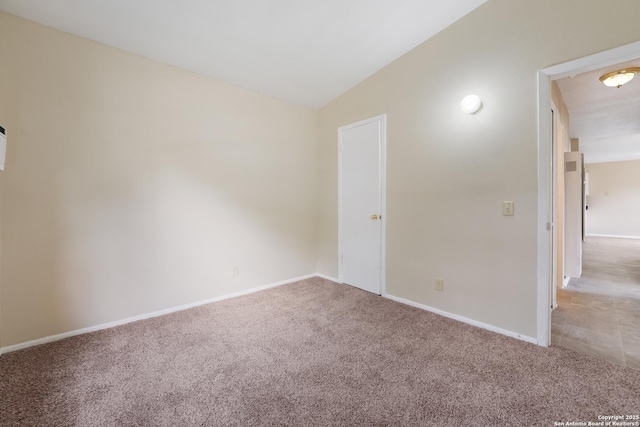 4863 Castle Shield, San Antonio, TX 78218 - empty room featuring light colored carpet, lofted ceiling, and baseboards
