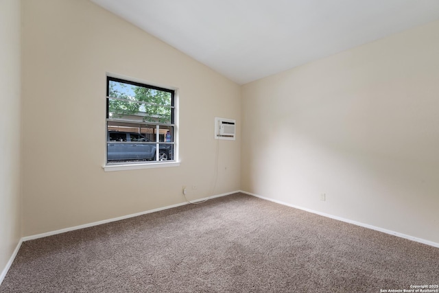 4863 Castle Shield, San Antonio, TX 78218 - carpeted spare room with a wall unit AC, baseboards, and vaulted ceiling