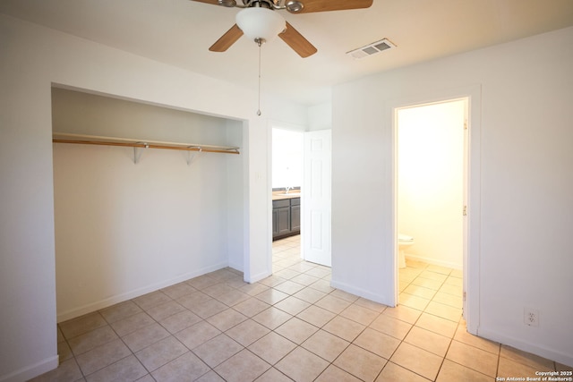 3258 Twining, San Antonio, TX 78211 - unfurnished bedroom with light tile patterned flooring, a closet, connected bathroom, and ceiling fan