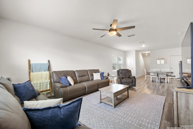 12855 Cygnus, San Antonio, TX 78245 - living room featuring a ceiling fan and wood finished floors