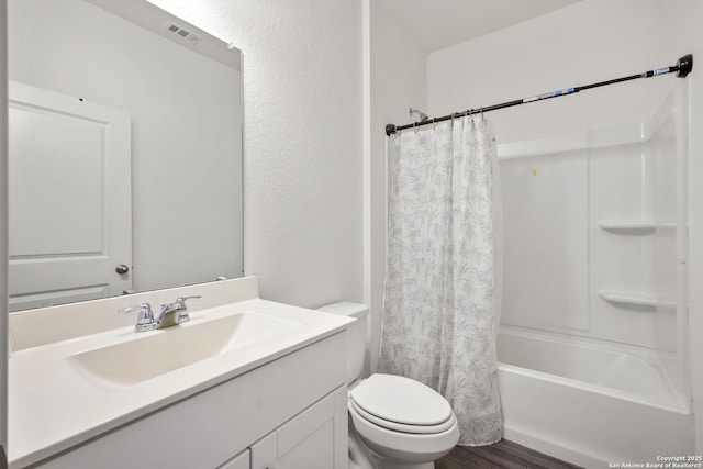 12855 Cygnus, San Antonio, TX 78245 - full bathroom with vanity, toilet, shower / tub combo, and wood finished floors