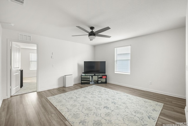 12855 Cygnus, San Antonio, TX 78245 - living area featuring wood finished floors, ceiling fan, and baseboards