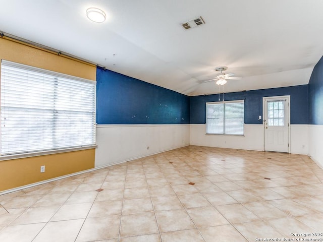 14342 Markham Ln, San Antonio, TX 78247 - unfurnished room featuring a ceiling fan, a wainscoted wall, and lofted ceiling