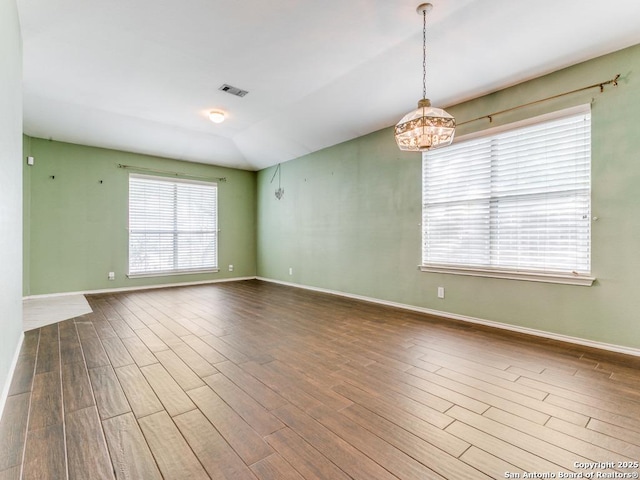 14342 Markham Ln, San Antonio, TX 78247 - empty room featuring wood finished floors, baseboards, and a chandelier