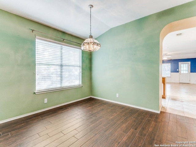 14342 Markham Ln, San Antonio, TX 78247 - spare room with wood finished floors, arched walkways, baseboards, lofted ceiling, and a ceiling fan
