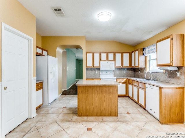 14342 Markham Ln, San Antonio, TX 78247 - kitchen featuring white appliances, light countertops, a sink, a kitchen island, and vaulted ceiling