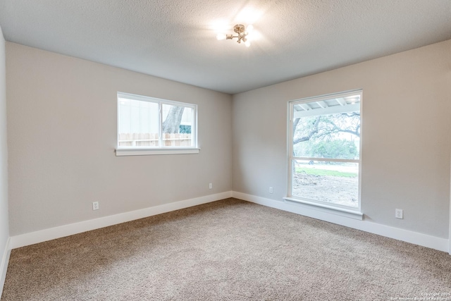 1071 Diamondhead Dr, Canyon Lake, TX 78133 - carpeted spare room featuring baseboards and a textured ceiling