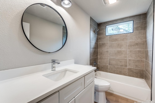 1071 Diamondhead Dr, Canyon Lake, TX 78133 - bathroom with toilet, vanity, shower / tub combination, and wood finished floors