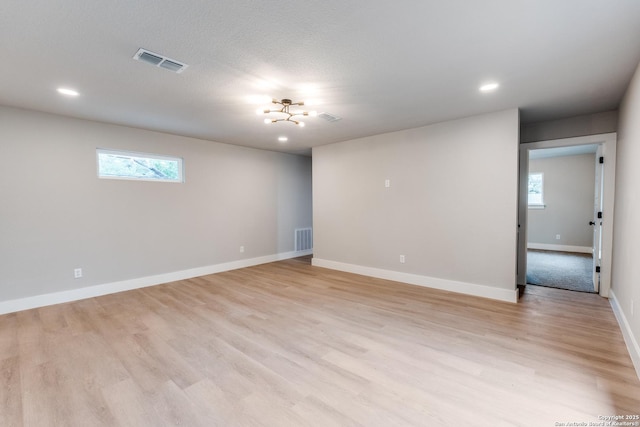 1071 Diamondhead Dr, Canyon Lake, TX 78133 - spare room featuring healthy amount of natural light, baseboards, recessed lighting, and light wood-type flooring