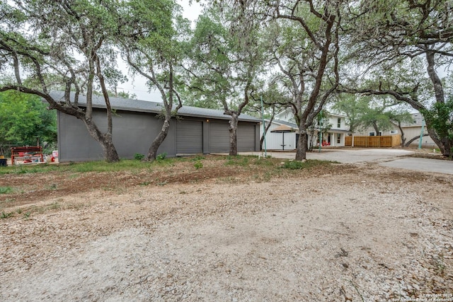 1071 Diamondhead Dr, Canyon Lake, TX 78133 - view of home's exterior with a garage
