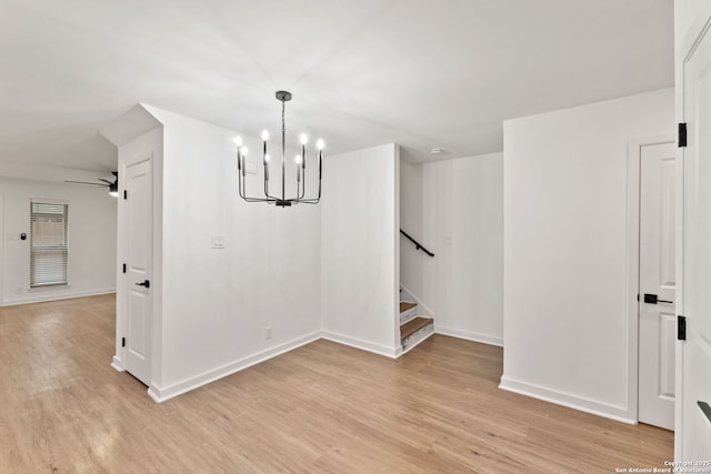 2718 Old Field Dr Unit 101, San Antonio, TX 78247 - unfurnished dining area featuring a chandelier, light wood-style floors, stairway, and baseboards