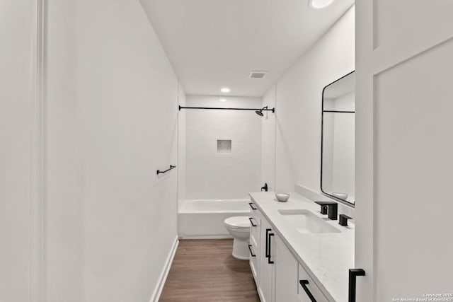 2718 Old Field Dr Unit 101, San Antonio, TX 78247 - bathroom featuring toilet, vanity, wood finished floors, tub / shower combination, and recessed lighting