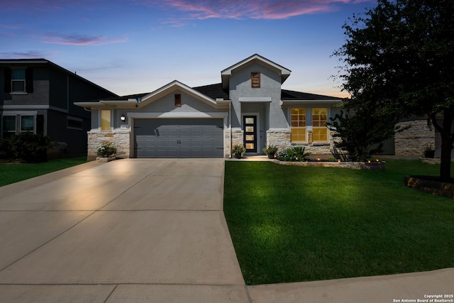 2415 Olive Way, San Antonio, TX 78259 - view of front of house featuring stone siding, an attached garage, concrete driveway, and a lawn