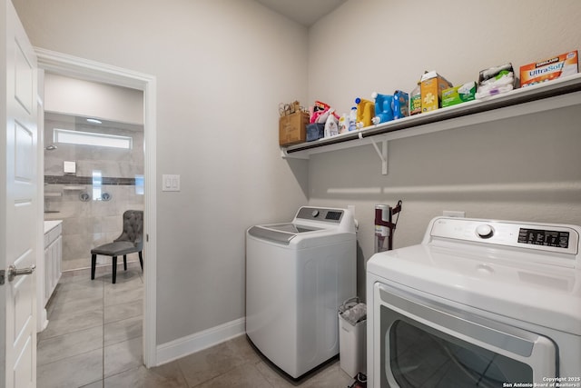 2415 Olive Way, San Antonio, TX 78259 - washroom with separate washer and dryer, light tile patterned floors, and baseboards
