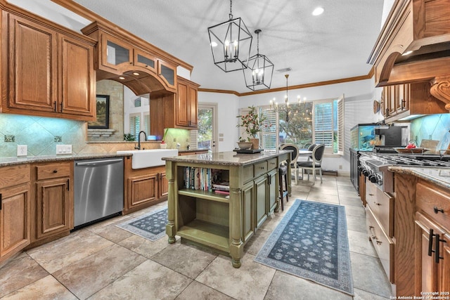1015 Campanile, San Antonio, TX 78258 - kitchen featuring stainless steel appliances, a sink, a chandelier, brown cabinets, and tasteful backsplash
