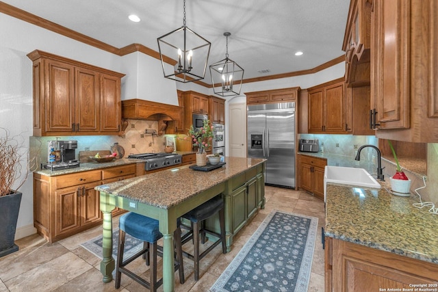 1015 Campanile, San Antonio, TX 78258 - kitchen featuring appliances with stainless steel finishes, a sink, a kitchen island, backsplash, and ornamental molding