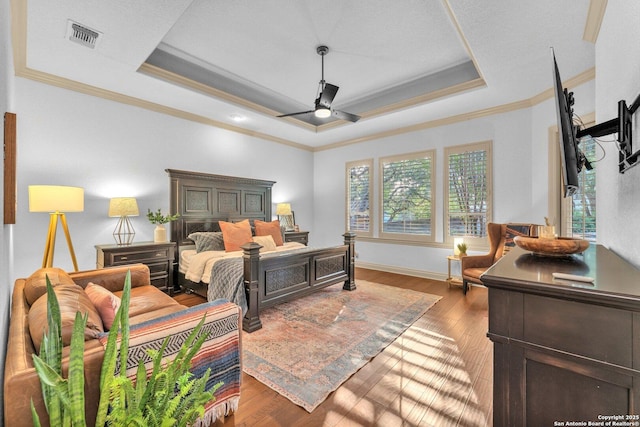 1015 Campanile, San Antonio, TX 78258 - bedroom featuring a raised ceiling, crown molding, wood finished floors, baseboards, and ceiling fan