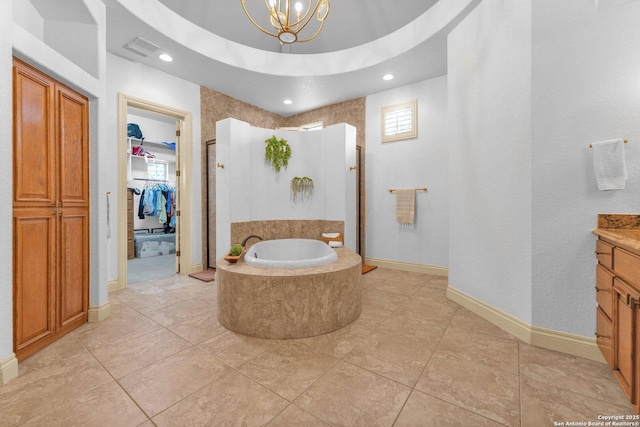 1015 Campanile, San Antonio, TX 78258 - full bathroom featuring a shower stall, vanity, a garden tub, a chandelier, and a walk in closet