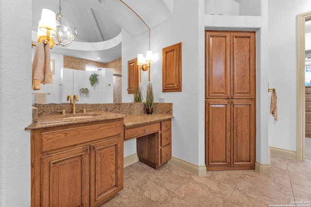 1015 Campanile, San Antonio, TX 78258 - bathroom with vanity, a walk in shower, a chandelier, tile patterned flooring, and a textured wall