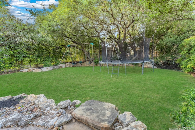 1015 Campanile, San Antonio, TX 78258 - view of yard with a trampoline and a playground