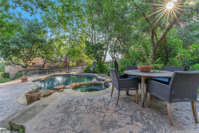 1015 Campanile, San Antonio, TX 78258 - view of pool with a patio, a pool with connected hot tub, and outdoor dining area