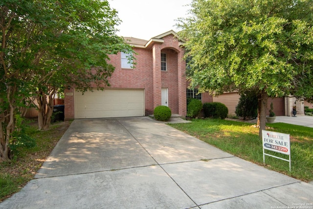 7331 Obbligato Ln, San Antonio, TX 78266 - view of front of property featuring brick siding, driveway, a garage, and a front lawn