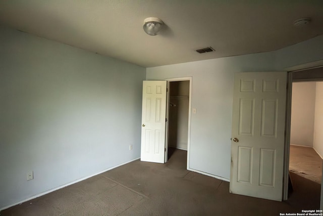 7331 Obbligato Ln, San Antonio, TX 78266 - unfurnished bedroom featuring carpet flooring, a walk in closet, baseboards, and a closet