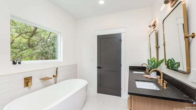 3140 Westview Dr, Canyon Lake, TX 78133 - bathroom featuring a freestanding bath, double vanity, and recessed lighting