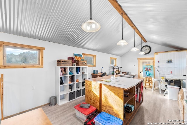 231 Doris Dr, Kerrville, TX 78028 - interior space with light wood finished floors, hanging light fixtures, and a center island