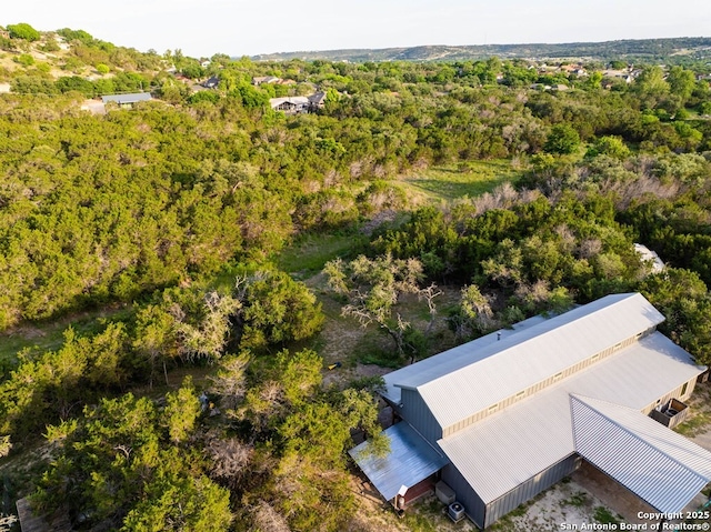 231 Doris Dr, Kerrville, TX 78028 - aerial view of property and surrounding area with a heavily wooded area