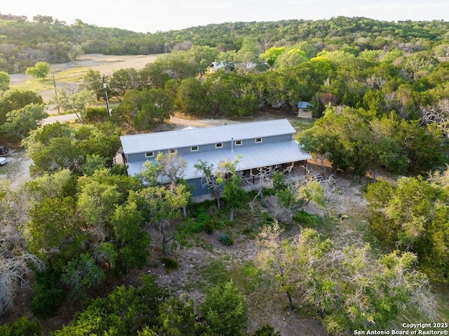 231 Doris Dr, Kerrville, TX 78028 - view of subject property with a heavily wooded area