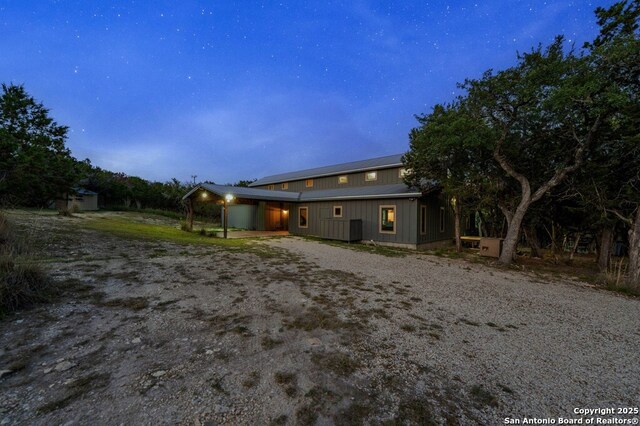 231 Doris Dr, Kerrville, TX 78028 - rear view of property featuring dirt driveway