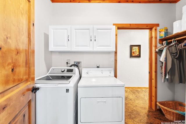 231 Doris Dr, Kerrville, TX 78028 - laundry area featuring washer and dryer and cabinet space