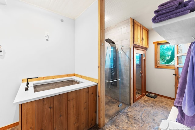 231 Doris Dr, Kerrville, TX 78028 - full bath featuring a shower stall, baseboards, and lofted ceiling