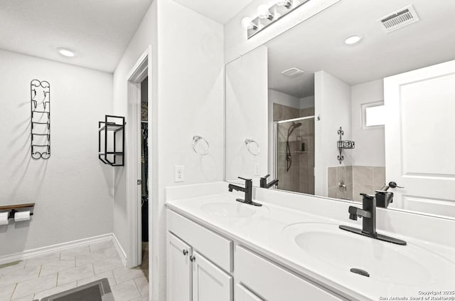 324 Washita Riv, Cibolo, TX 78108 - bathroom with a stall shower, double vanity, baseboards, and tile patterned flooring