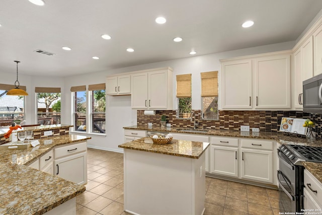 18719 Needle Rock, San Antonio, TX 78258 - kitchen with a sink, appliances with stainless steel finishes, a kitchen island, decorative backsplash, and recessed lighting