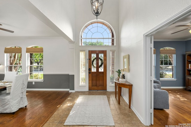 18719 Needle Rock, San Antonio, TX 78258 - foyer featuring ceiling fan, healthy amount of natural light, wood-type flooring, and crown molding