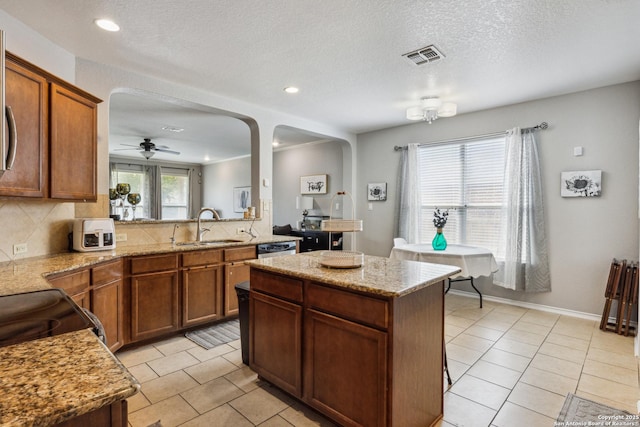 13508 Ashmont, Live Oak, TX 78233 - kitchen with a sink, arched walkways, recessed lighting, a kitchen island, and ceiling fan