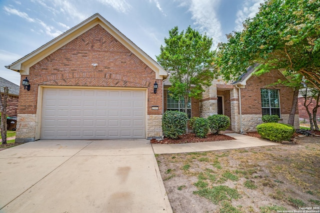 12406 Prince Solms, San Antonio, TX 78253 - view of front of home featuring brick siding, driveway, stone siding, and an attached garage