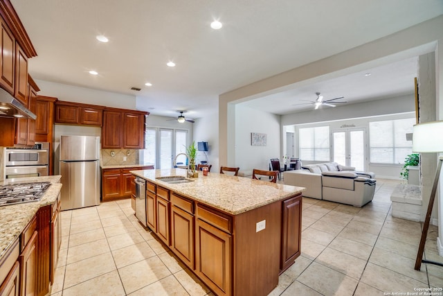 12406 Prince Solms, San Antonio, TX 78253 - kitchen featuring a sink, stainless steel appliances, ceiling fan, decorative backsplash, and recessed lighting