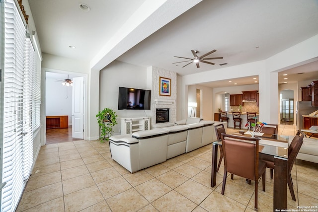 12406 Prince Solms, San Antonio, TX 78253 - living room featuring a ceiling fan, light tile patterned floors, a large fireplace, recessed lighting, and baseboards