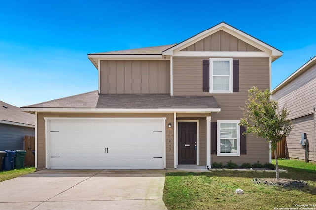 11042 Eyelet Hbr, Converse, TX 78109 - view of front of house with a front yard, driveway, board and batten siding, a shingled roof, and a garage