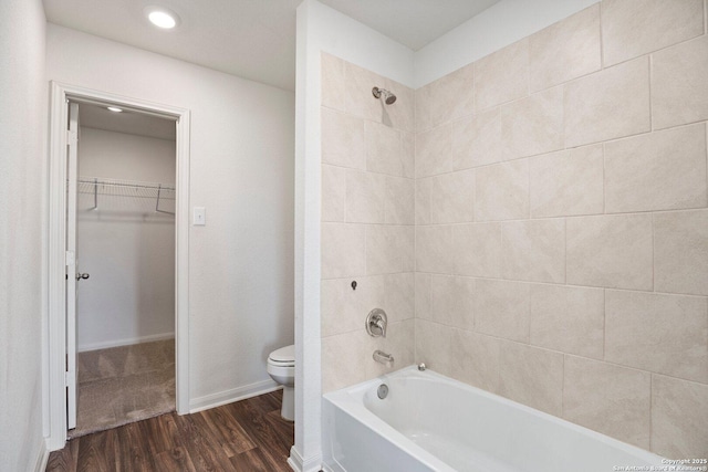 11042 Eyelet Hbr, Converse, TX 78109 - full bathroom featuring toilet, wood finished floors, bathing tub / shower combination, and a walk in closet