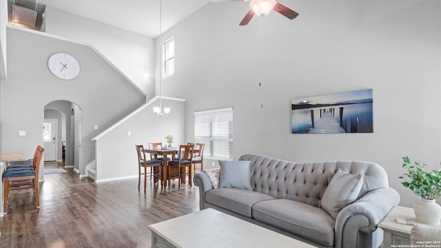 7110 Marina Del Rey, Converse, TX 78109 - living area with arched walkways, a high ceiling, ceiling fan, wood finished floors, and baseboards